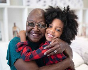 grandmother hugging child